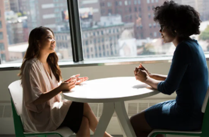 People talking at a table