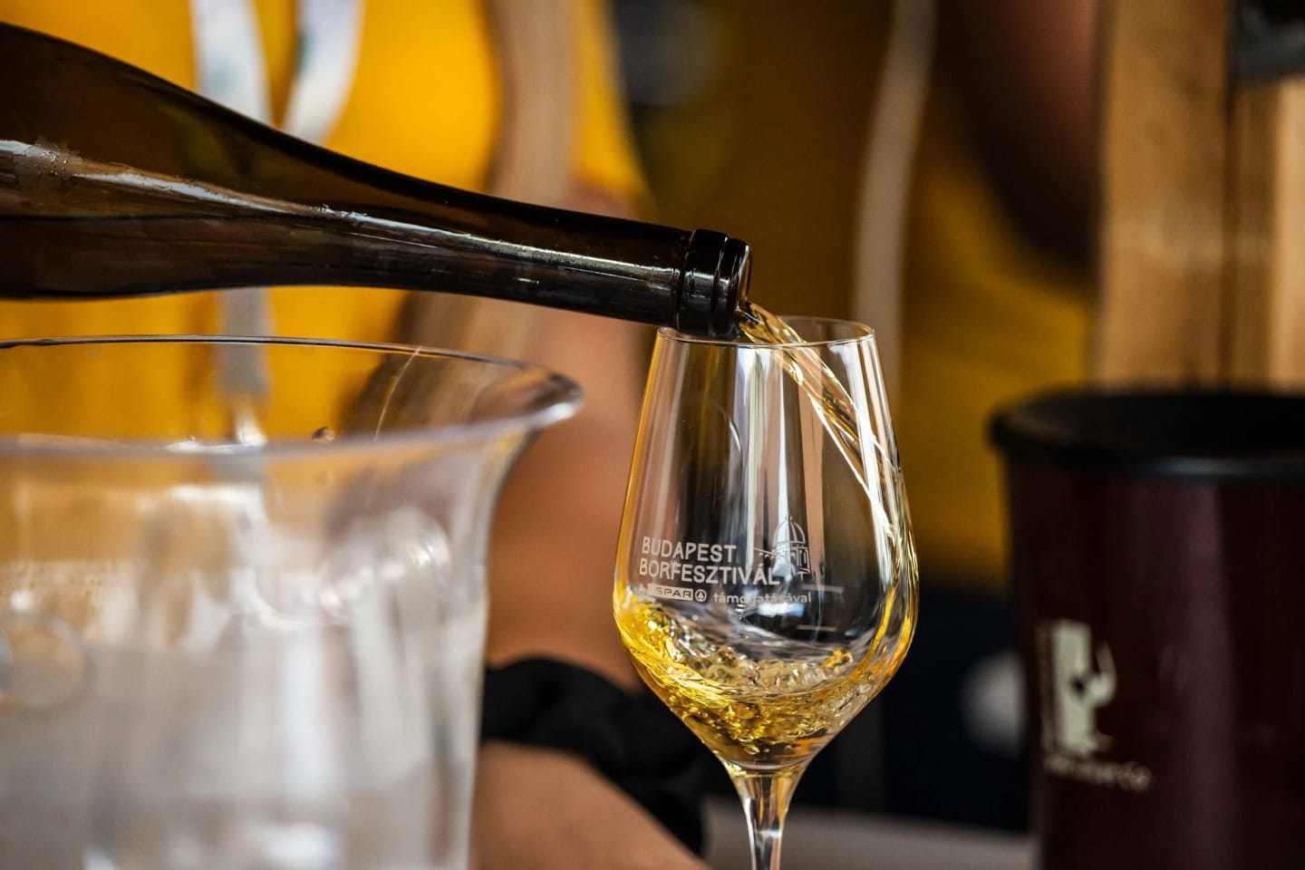 Wine being poured into a Budapest Wine Festival tasting glass