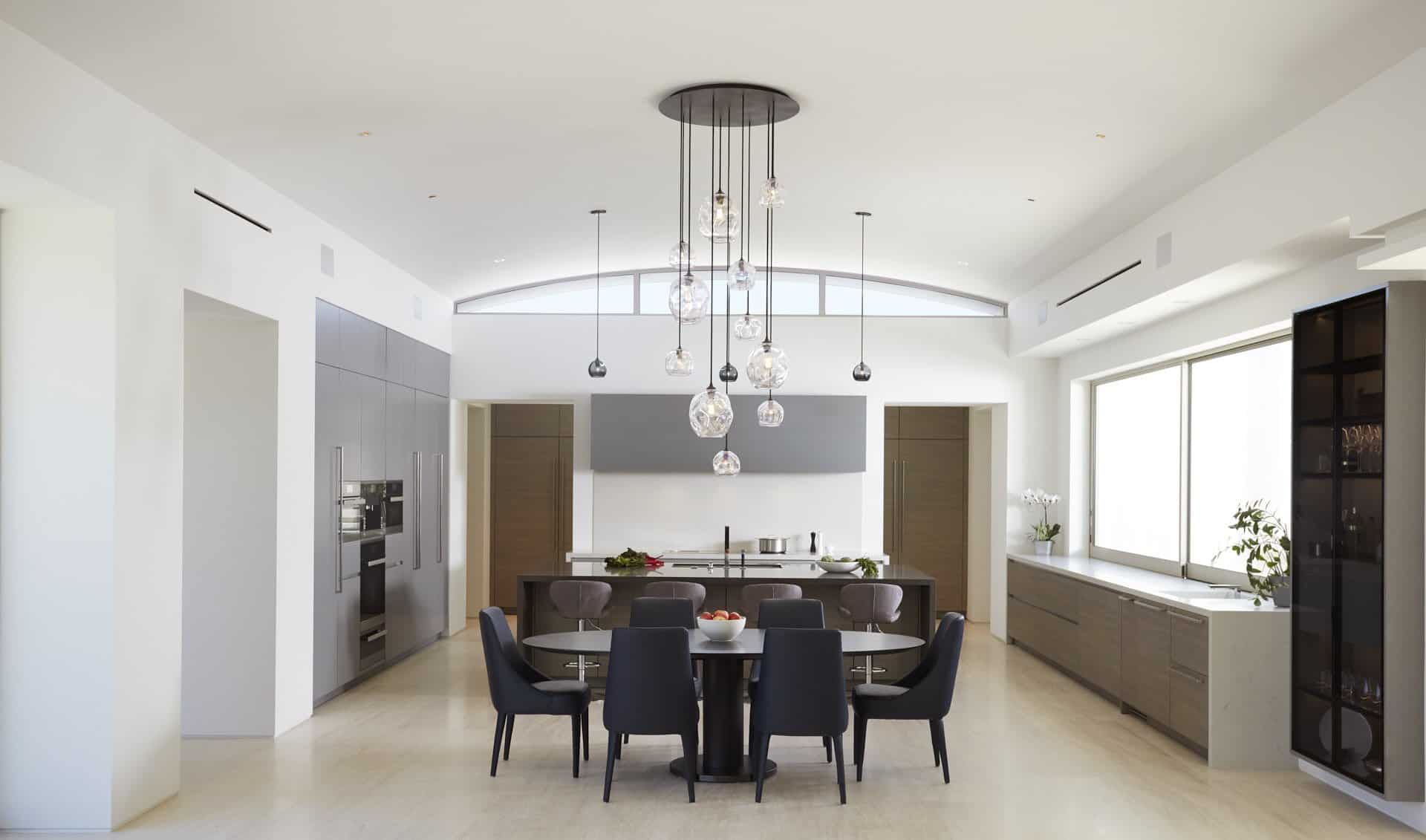 Main kitchen with luxurious dining area with German-made cabinets by eggersmann