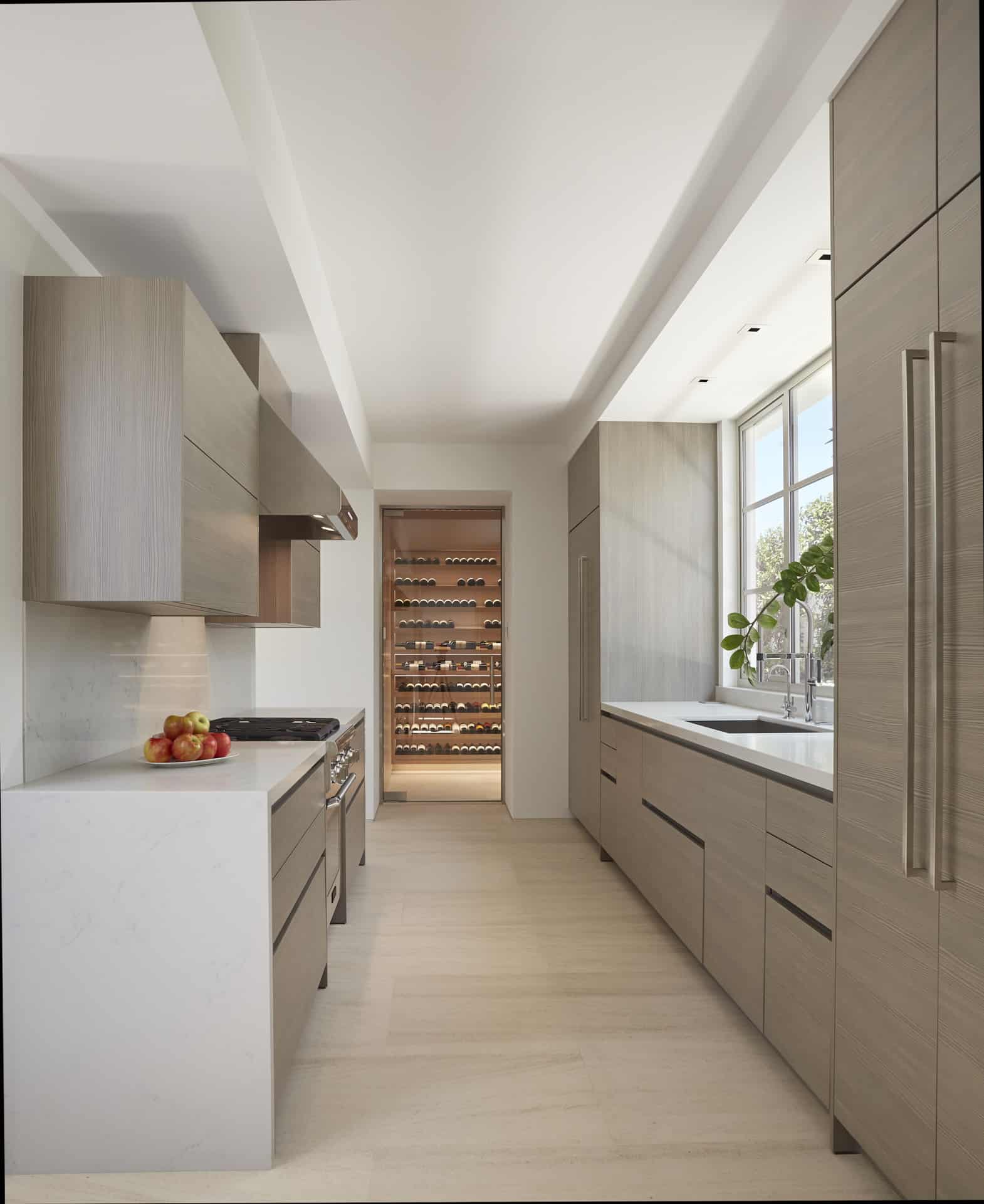 Butler's pantry with full kitchen and glass-front wine cellar