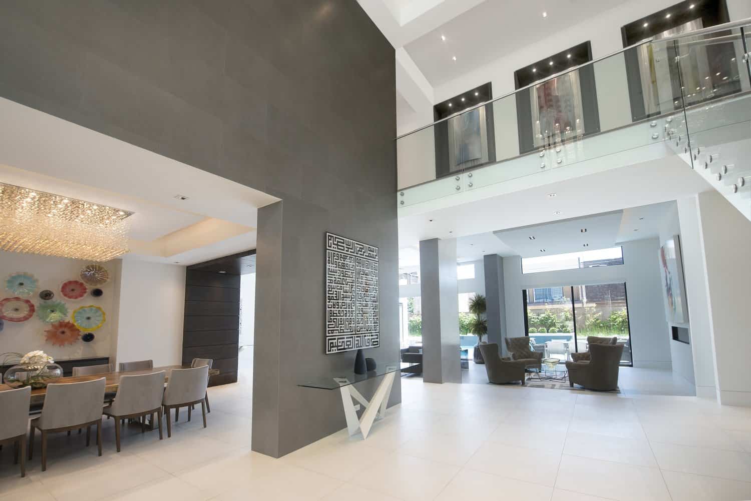lighted art niches designed by eggersmann match the kitchen wood tones and highlight the homeowners' art collection