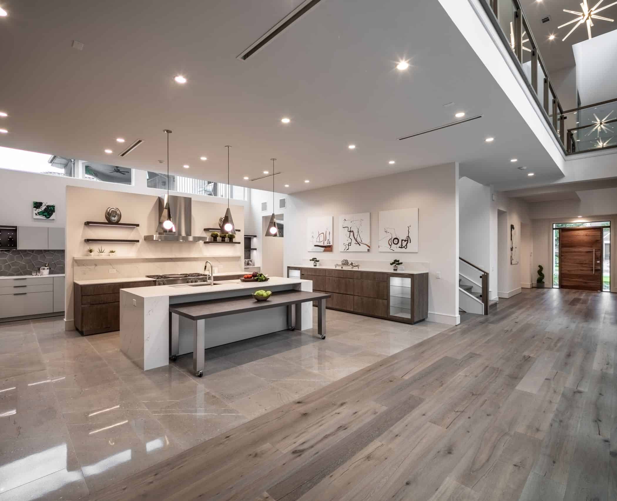 the new modern eggersmann kitchen in this a washington coalition memorial park area home in houston is off the grand foyer of this home
