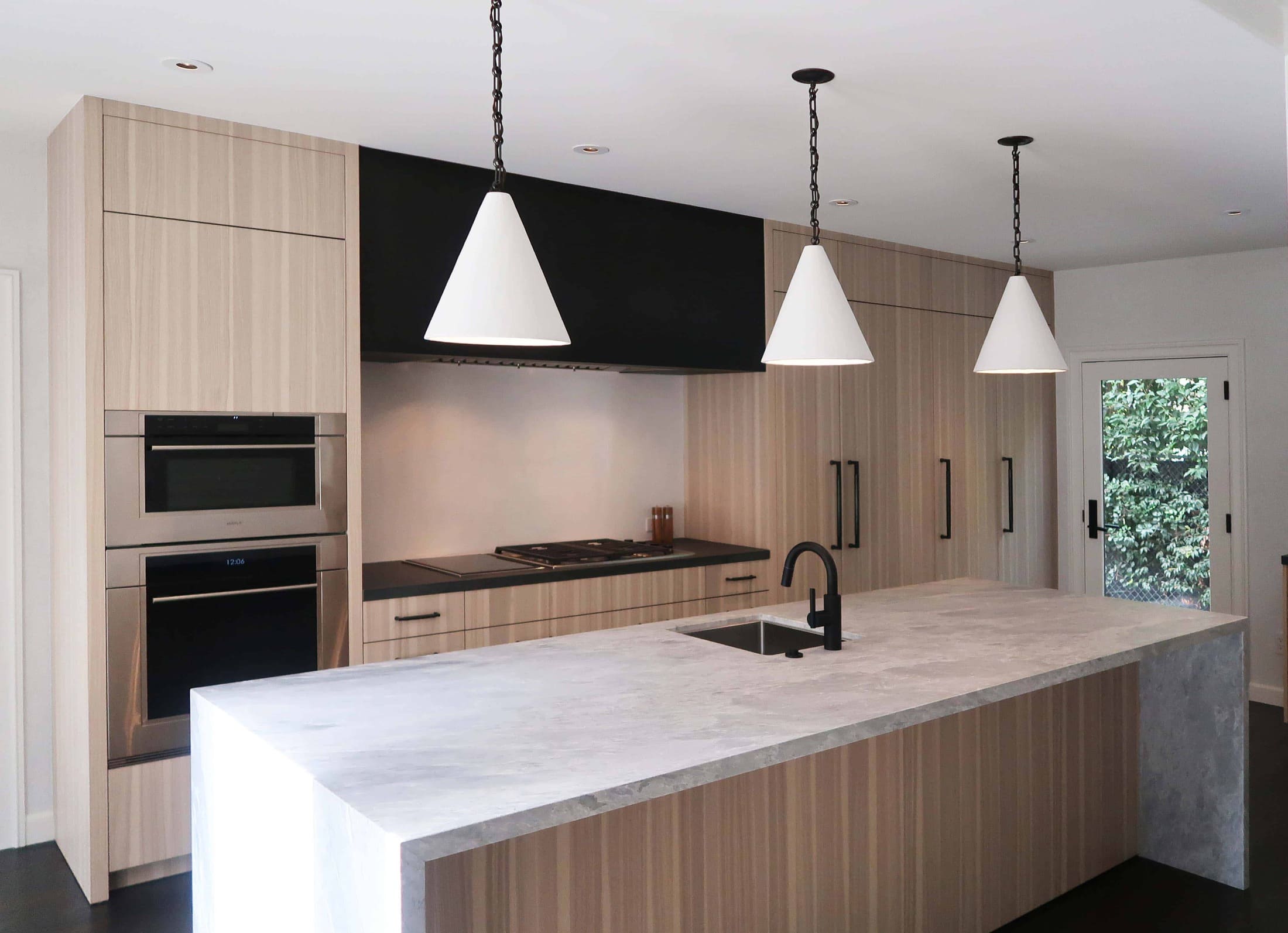 after picture of a modern eggersmann kitchen with traditional touches created in a hancock park traditional home in los angeles