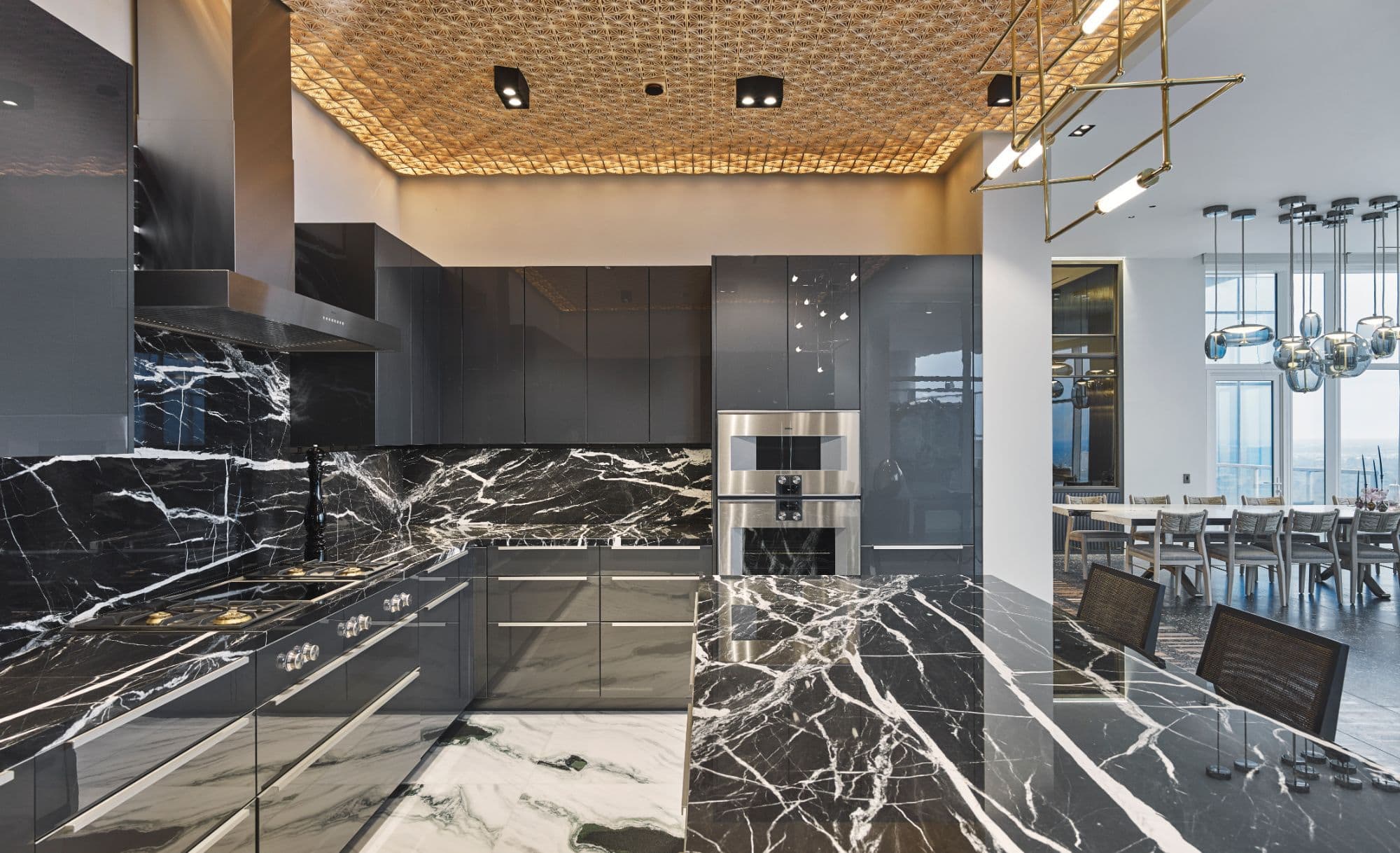 eggersmann kitchen with white-veined black marble and gaggenau appliances inside a penthouse of the arabella luxury high rise in houston