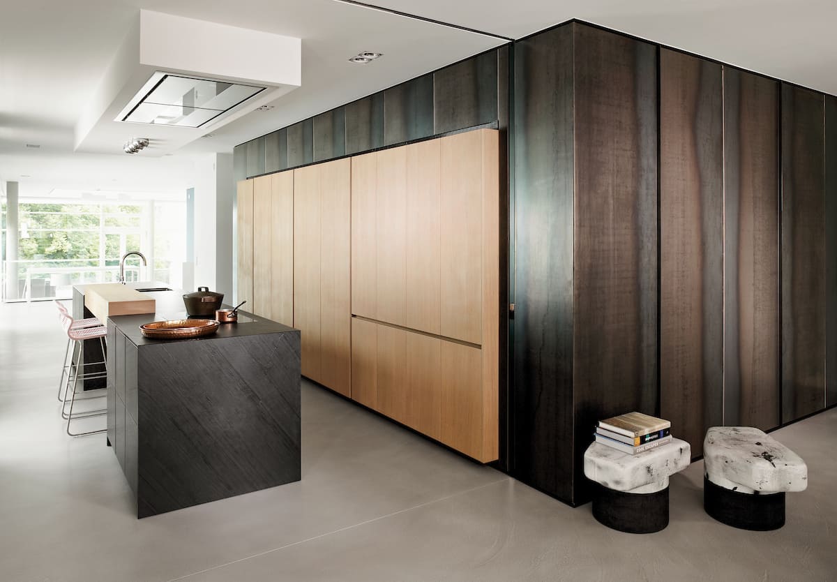 eggersmann'-designed kitchen featuring an island from the unique collection of cabinetry clad with phyllite black quartz
