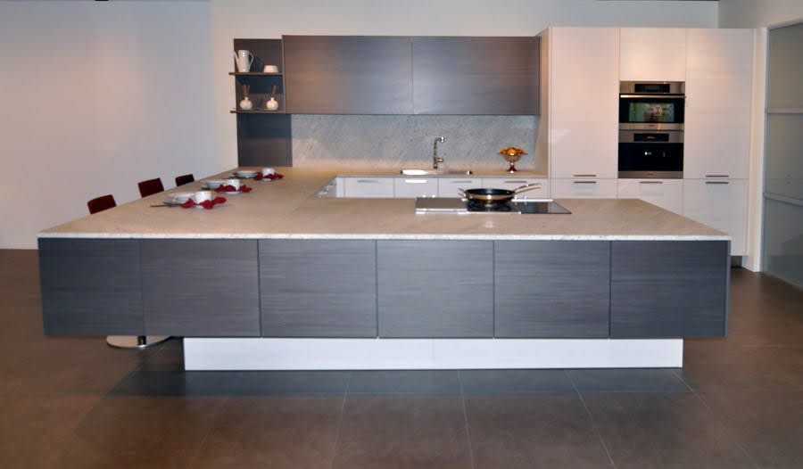 contemporary warm gray and white kitchen vignette featured in eggersmann florida german kitchen showroom in the DCOTA building