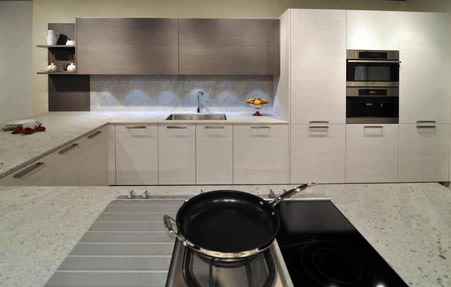 contemporary warm gray and white kitchen vignette featured in eggersmann florida german kitchen showroom in the DCOTA building