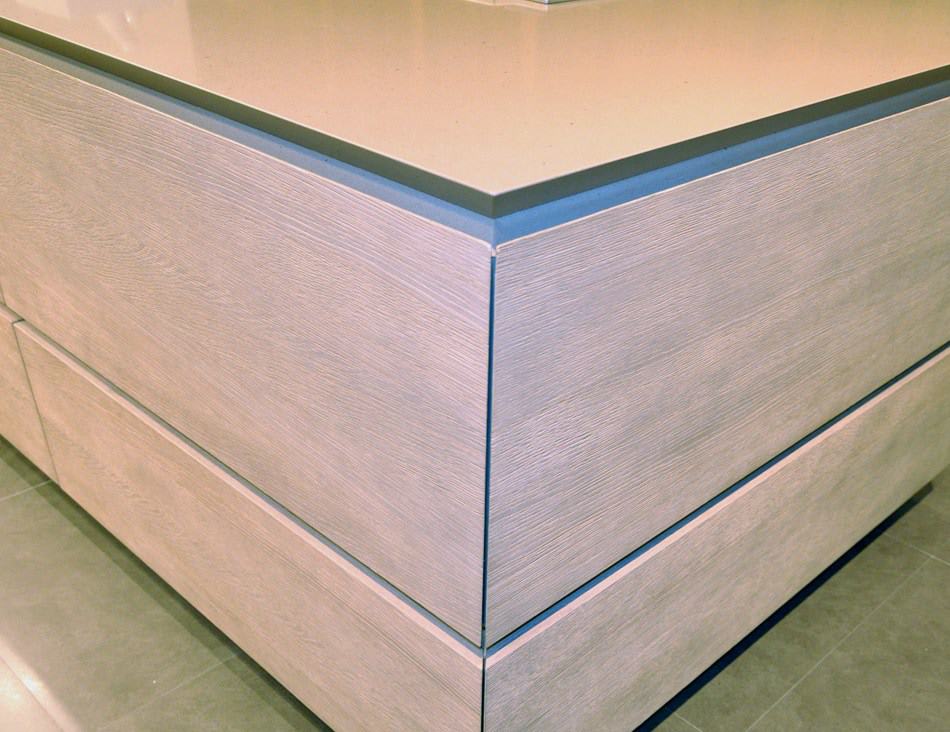 sandlbasted and smoked oak cabinetry featured in the eggersmann florida german kitchen showroom