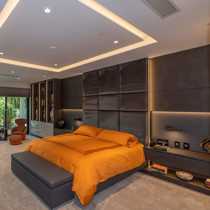 eggersmann-designed bedroom wall with orange bedspread