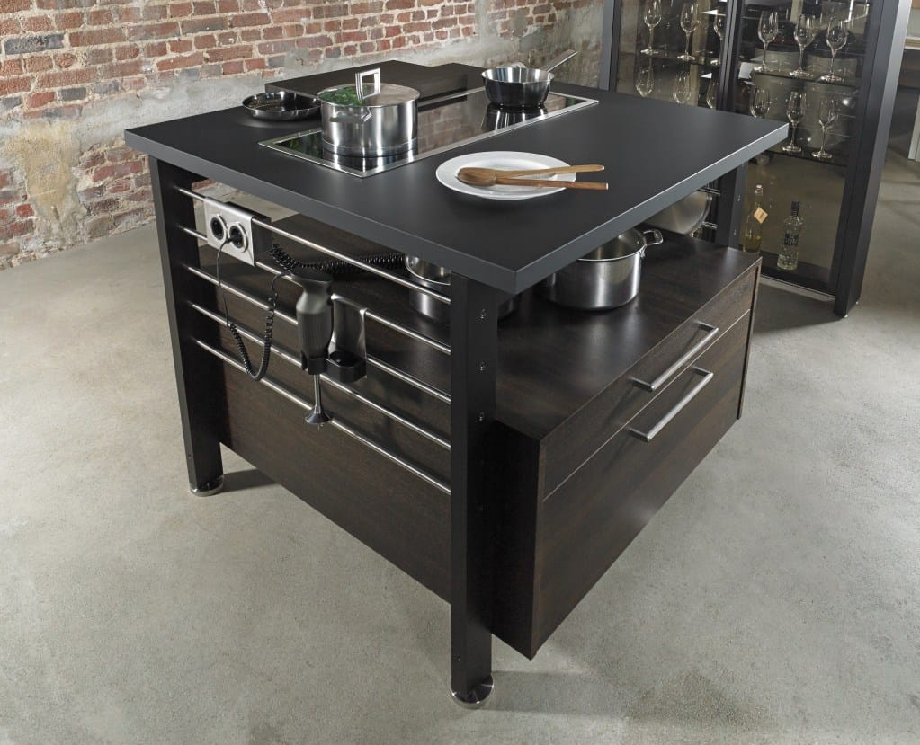 The Work's island with accessory features including power outlet and tool storage