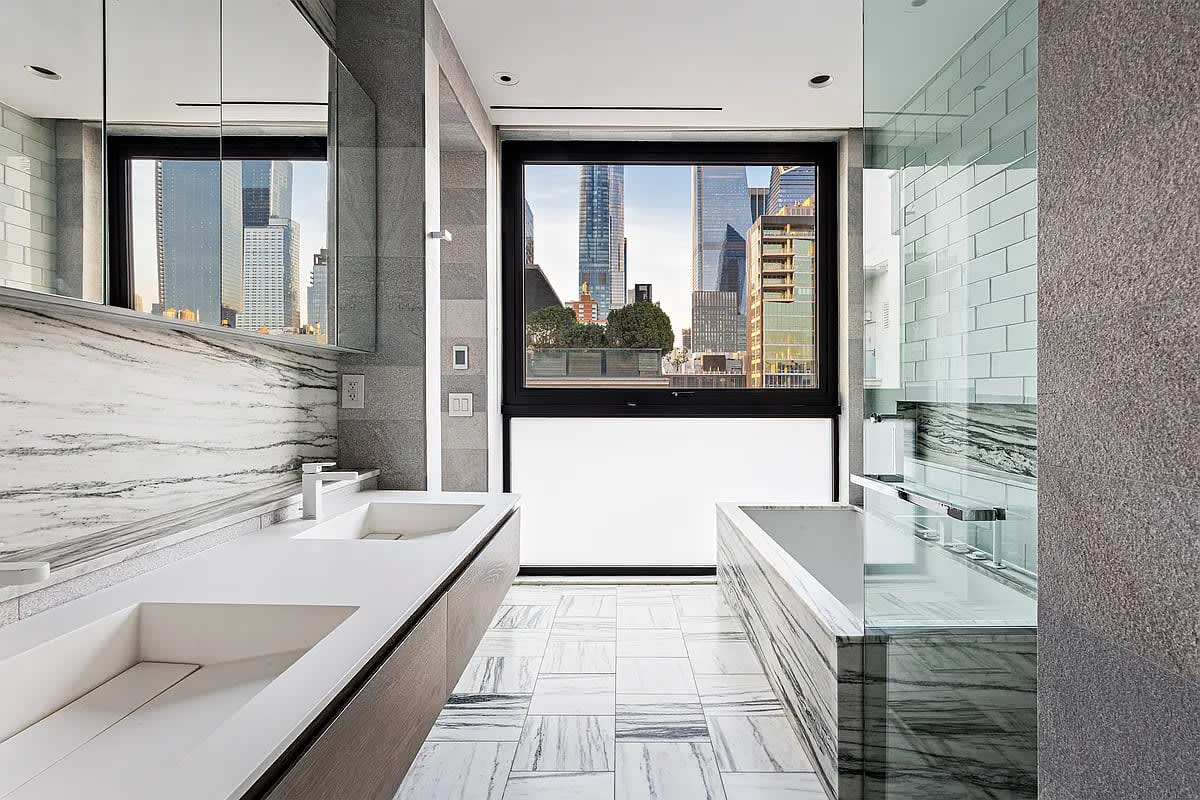 double vanity and garden tub in a luxury bath designed by eggersmann in a residence of chelsea waterside nyc