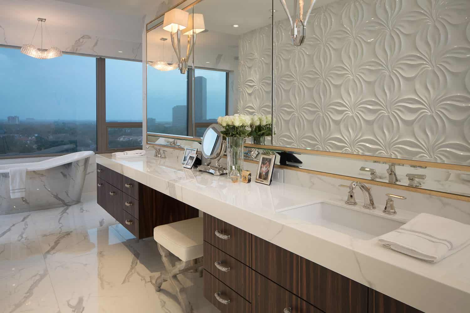 expansive custom double vanity with dressing table in this highrise apartment overlooking the skyline was designed by eggersmann