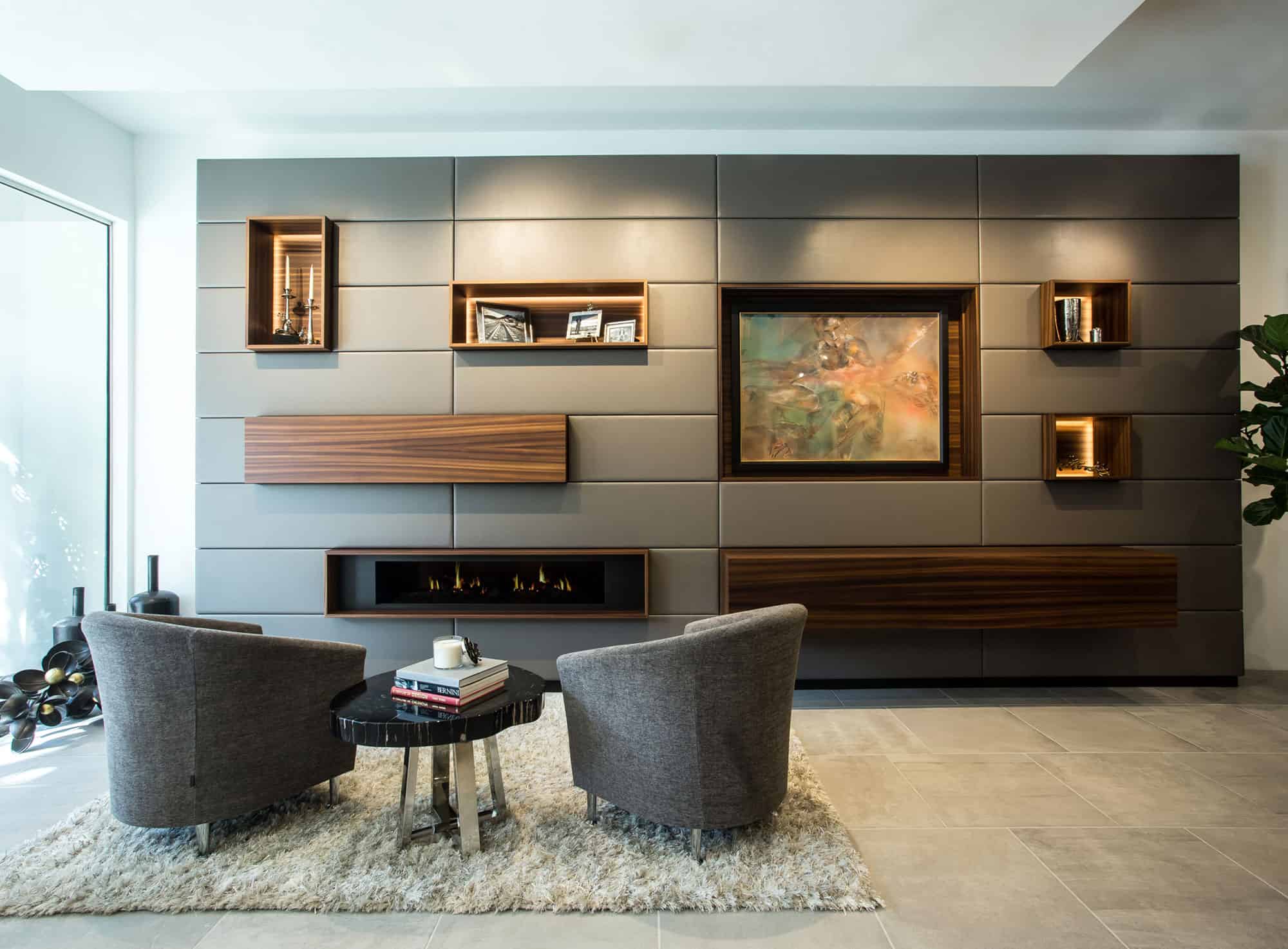 entertaining area with custom card-playing furniture and clever wall of hidden storage, bar, and electronics