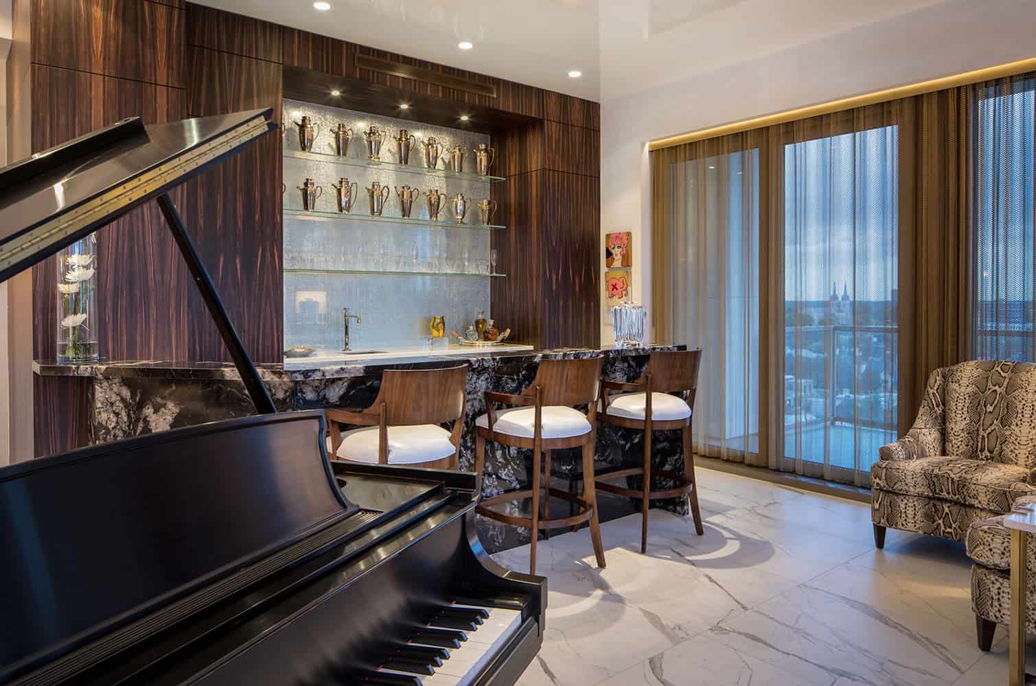custom bar with bespoke barstools for enjoying entertainment beside the grand piano