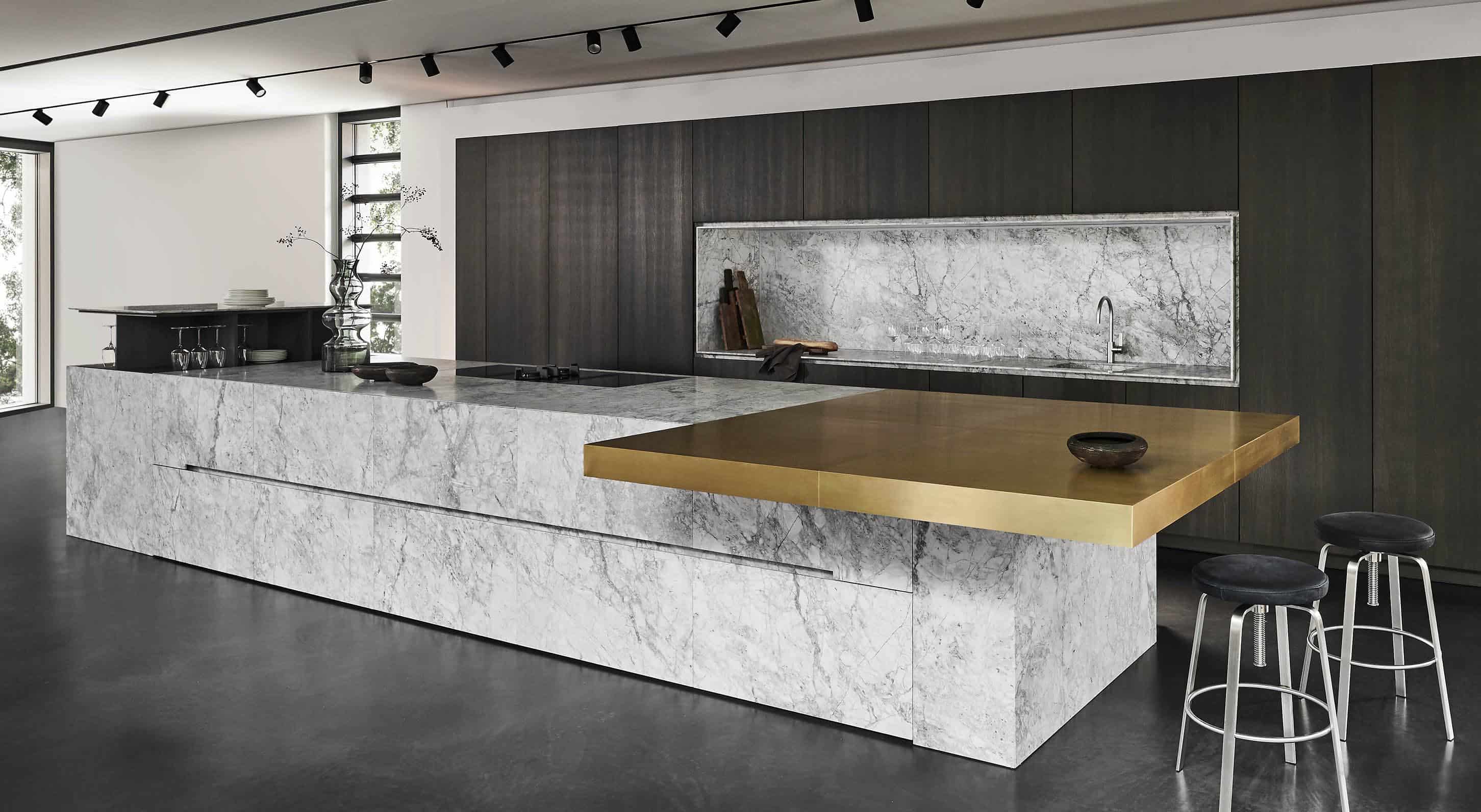 custom eggersmann kitchen using the unique cabinetry collection with Bianco Nuvola Quartzite, Brushed Brass, and Core Ash Veneer finishes