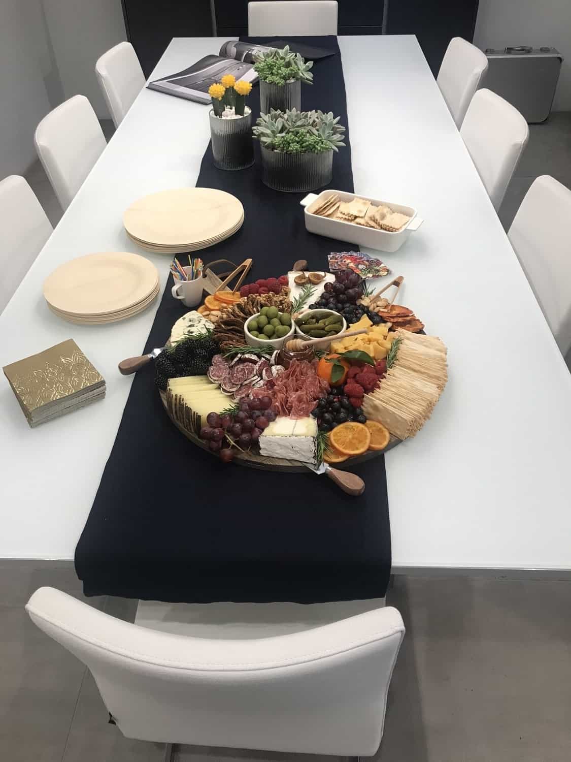 Cheese and relish tray designed by food stylist , Meg Quinn, set on the eggersmann LA showroom dining table