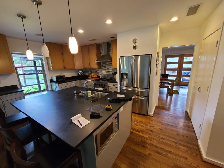 before picture of how the dividing wall between the kitchen and living area blocked light and conversation in an eggersmann kitchen renovation project in oak cliff neighborhood of dallas