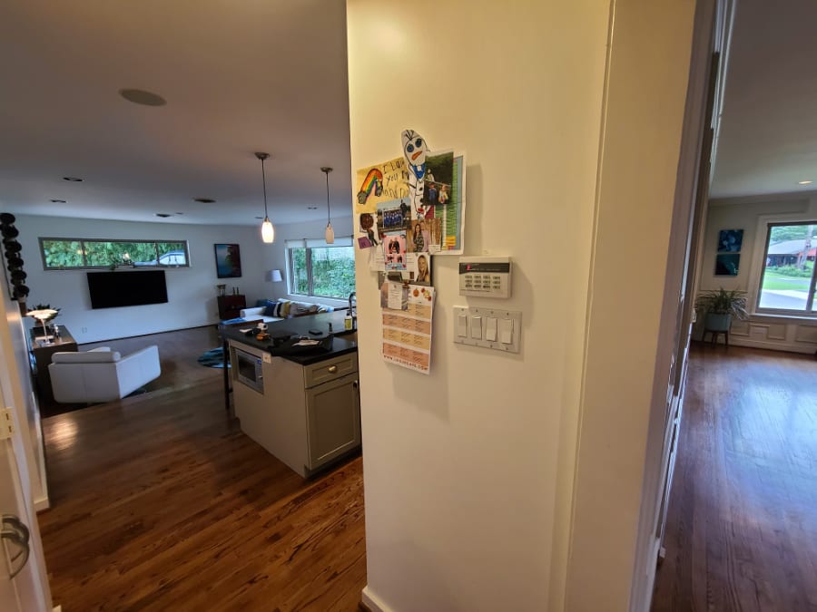 before picture of how the dividing wall between the kitchen and living area was so inconvenient in n eggersmann kitchen renovation project in oak cliff neighborhood of dallas
