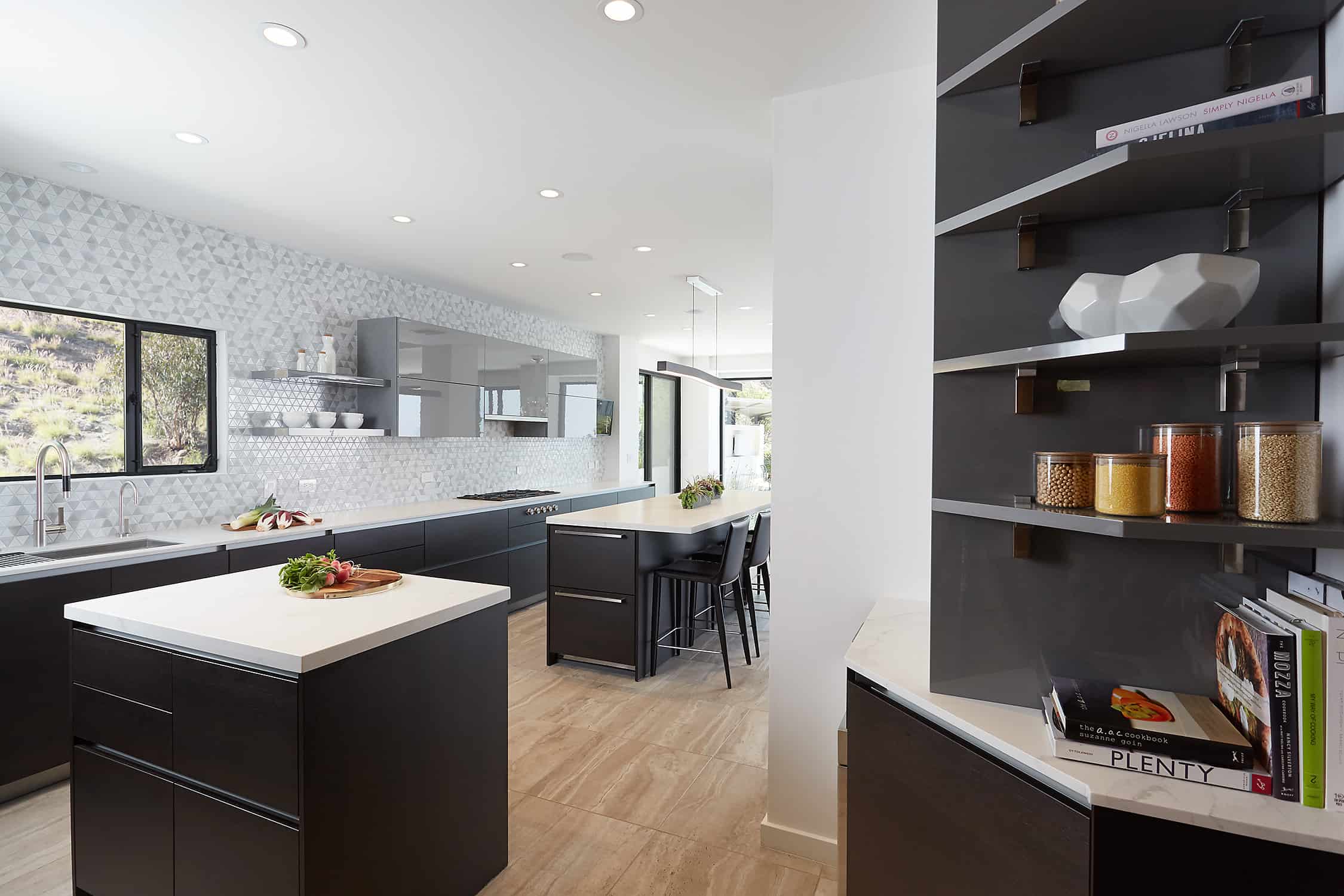 wide view including a bookshelf nook in the moussa kitchen project completed by eggersmann la