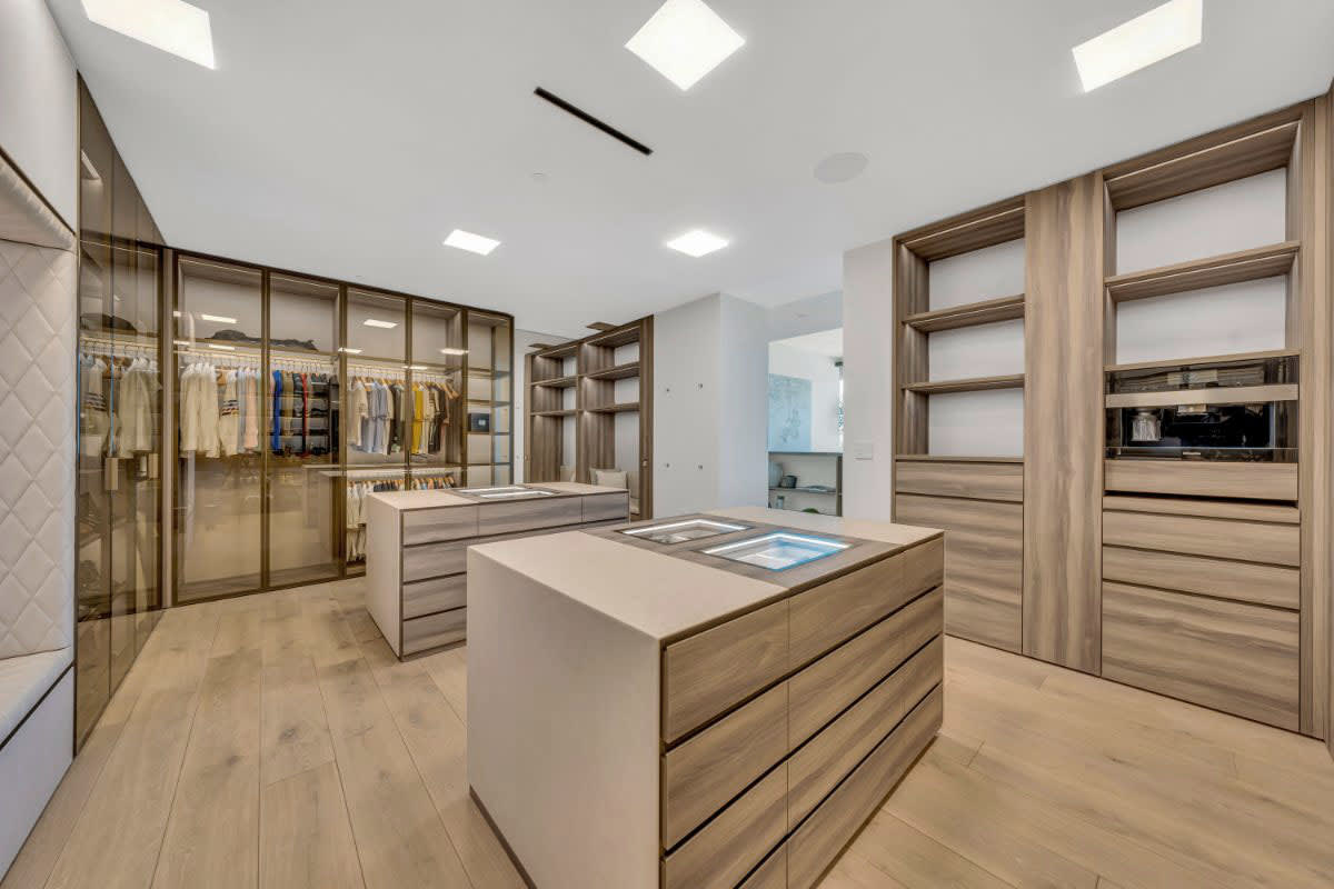 8899 beverly blvd jason oppenheim's master closet with leather bound islands
