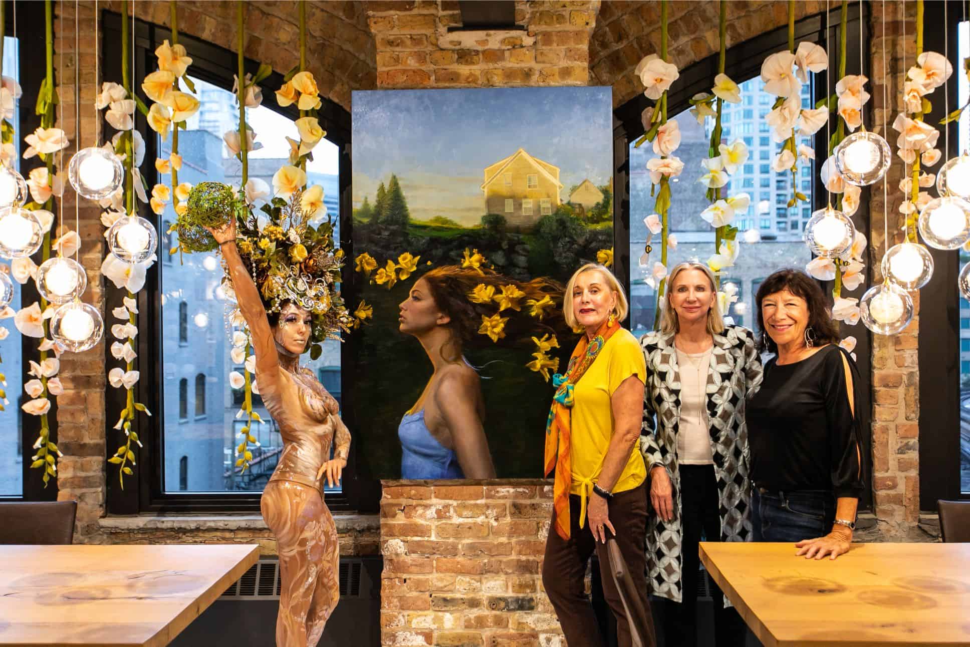 guests with featured artwork in the eggersmann kitchens chicago showroom during the rndd gallery walk 2019