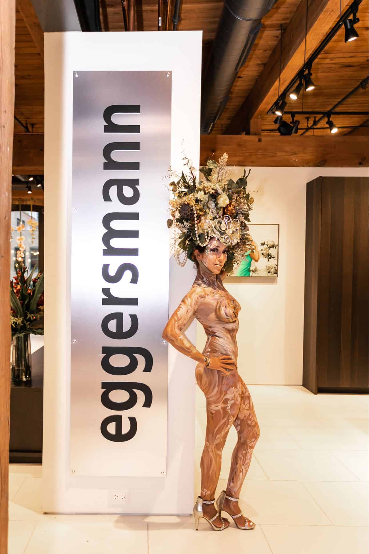 the living statue and the eggersmann showroom entrance sign