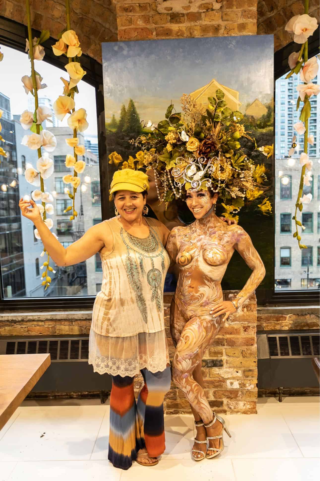 the living statue and the body paint artist rose cline who created her at the rndd gallery walk 2019 inside the eggersmann chicago showroom