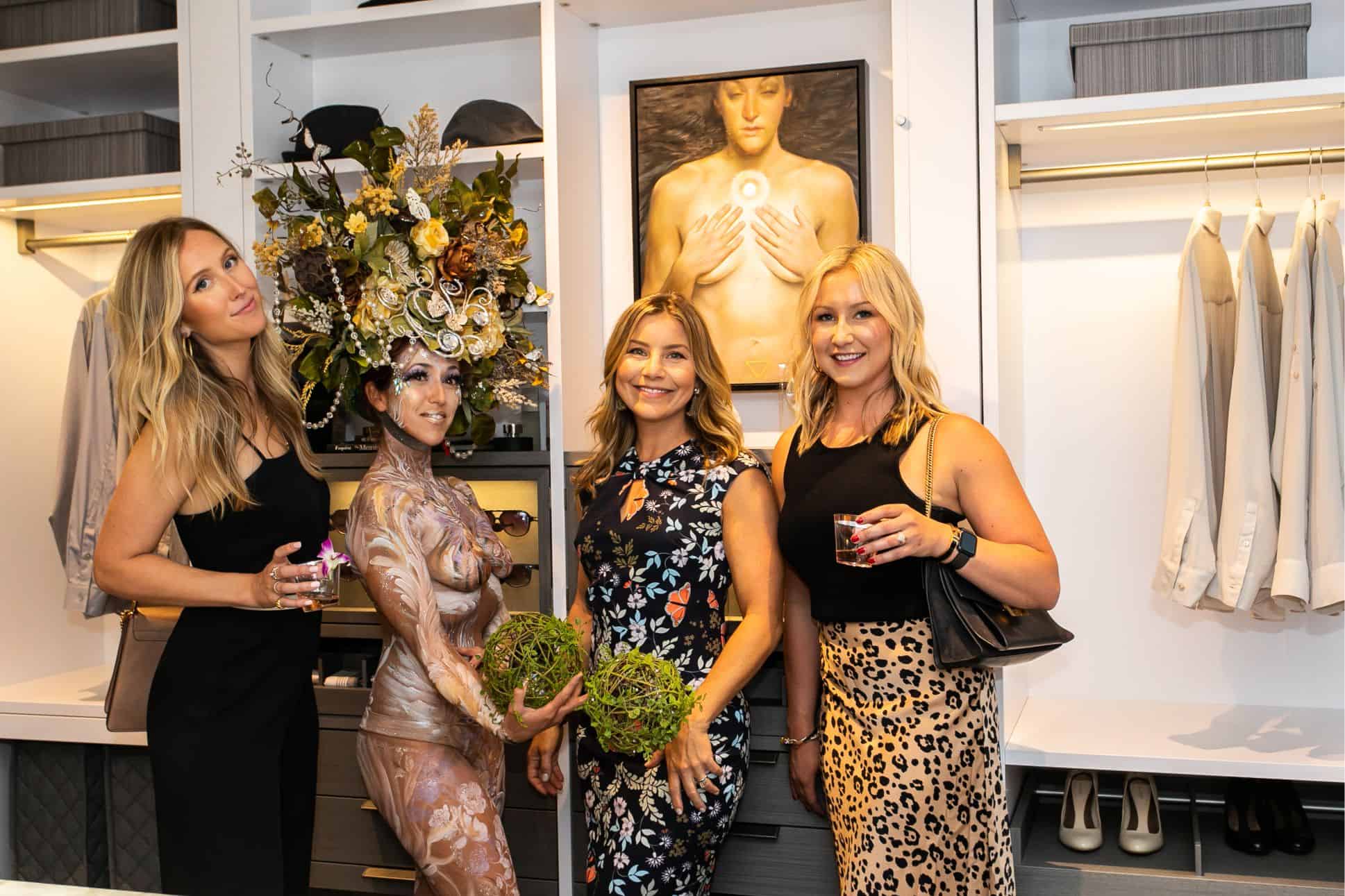 guests posing with the living statue at the rndd gallery walk 2019 in the eggersmann kitchens chicago showroom