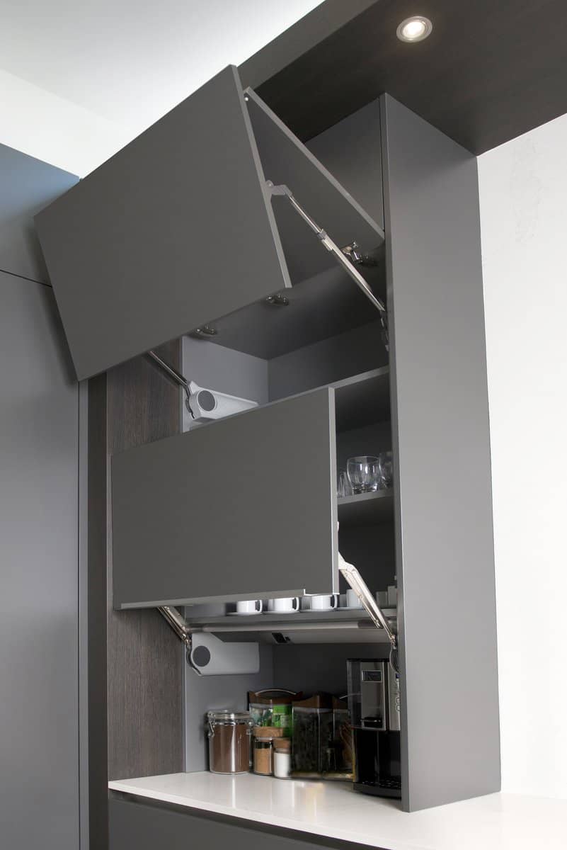 fold up doors on wall cabinetry create lots of storage and a convenient coffee bar