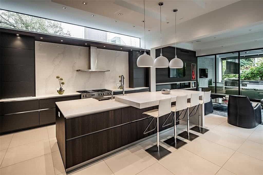 eggersmann kitchen island with dining countertop and miele stovetop