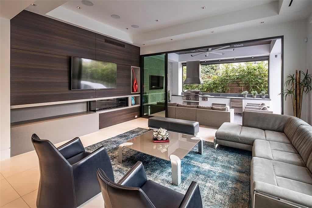 media room with fireplace surround and niches designed by eggersmann