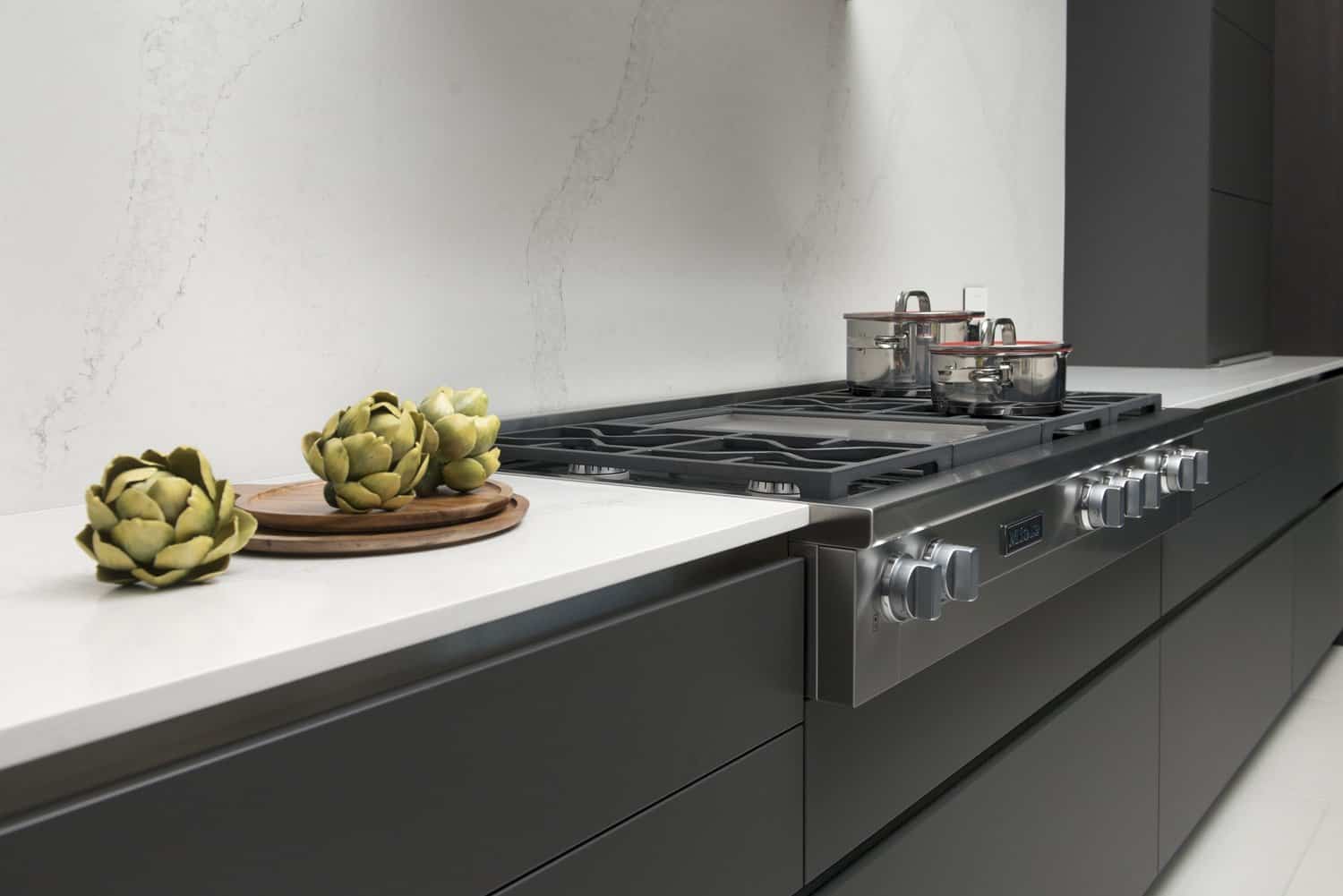 miele stovetop in caesarstone quartz countertop with matching backsplash