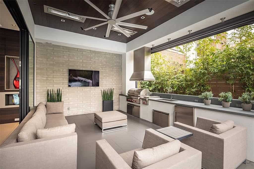 outdoor kitchen and lounge expands entertaiing and relaxing opportunities of this tanglewood home
