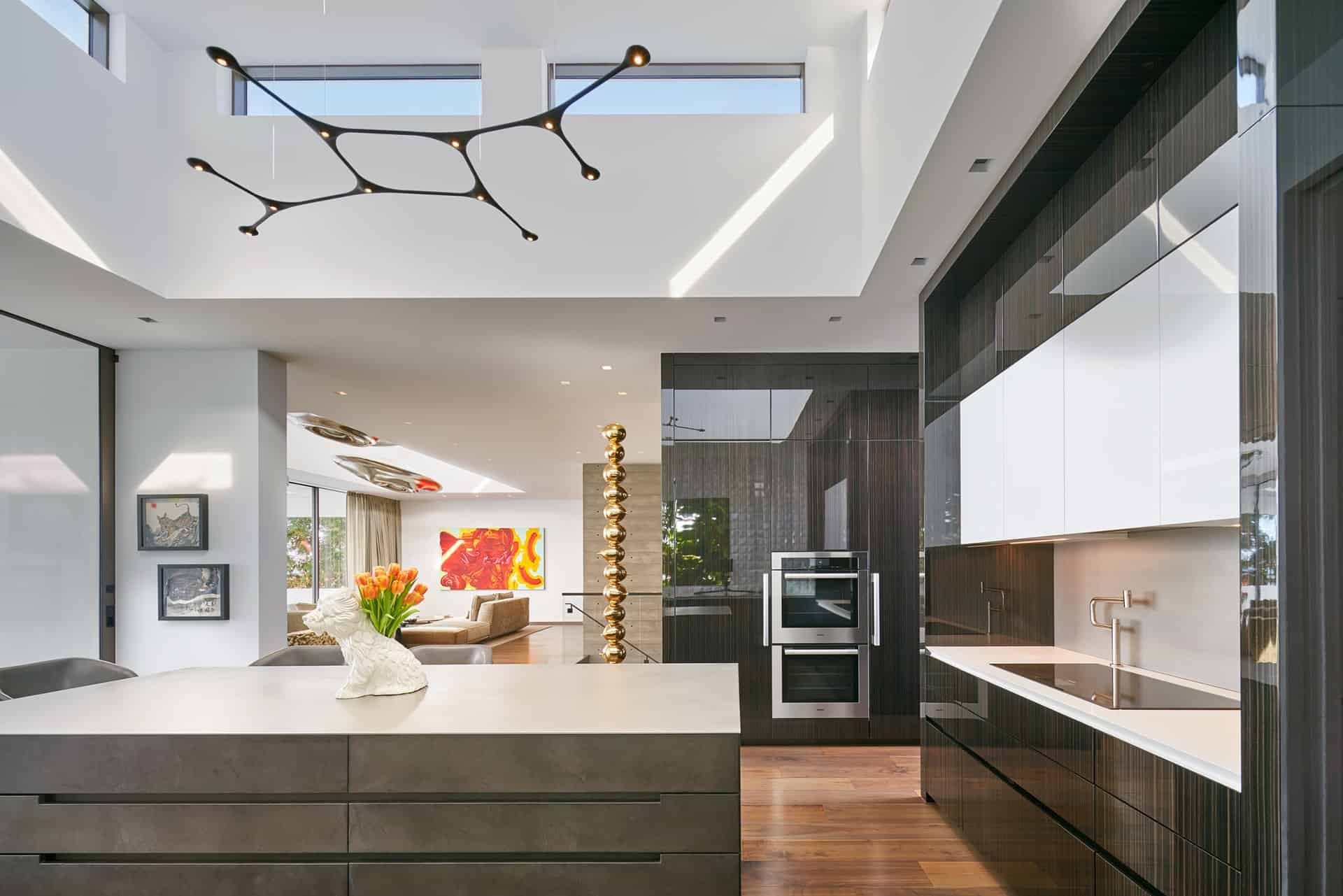 eggersmann kitchen in Fineline High Gloss Tricolor Ebony Veneer with Dark Concrete island