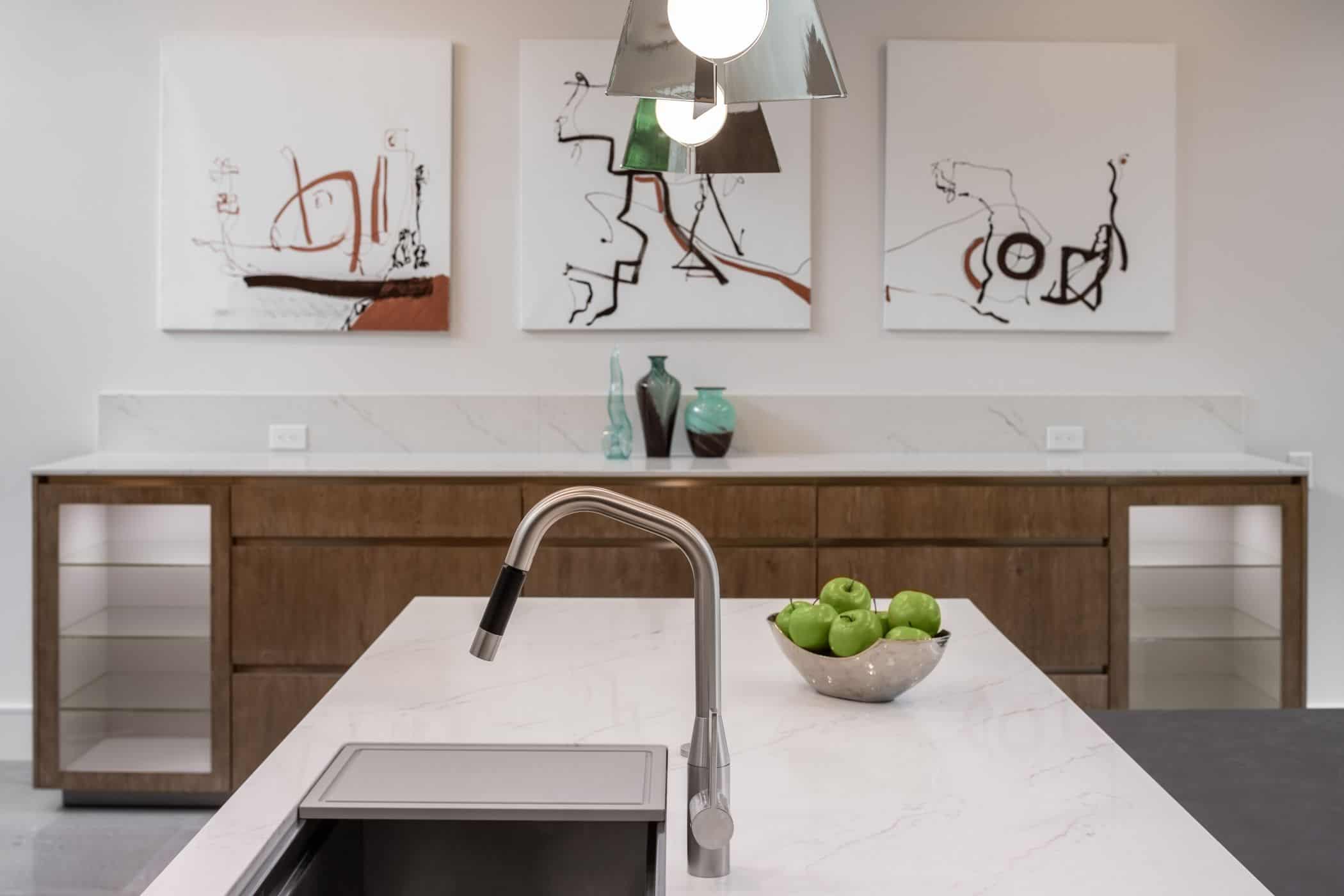 contrasting wood veneers and near-white countertops in a washington coalition memorial park area home in houston