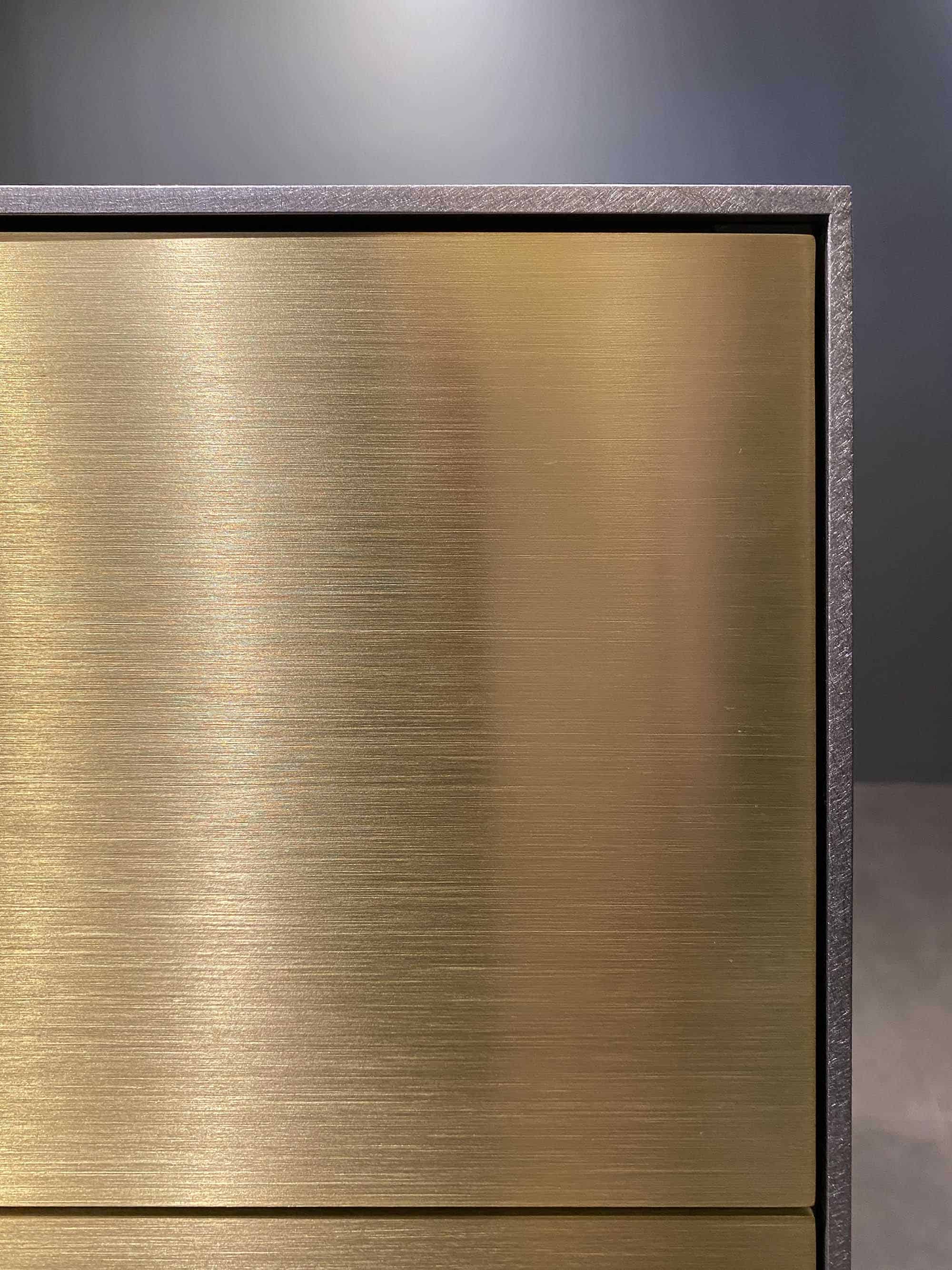 closeup detail of the handcrafted ventura brass finish on the eggersmann NY kitchen display