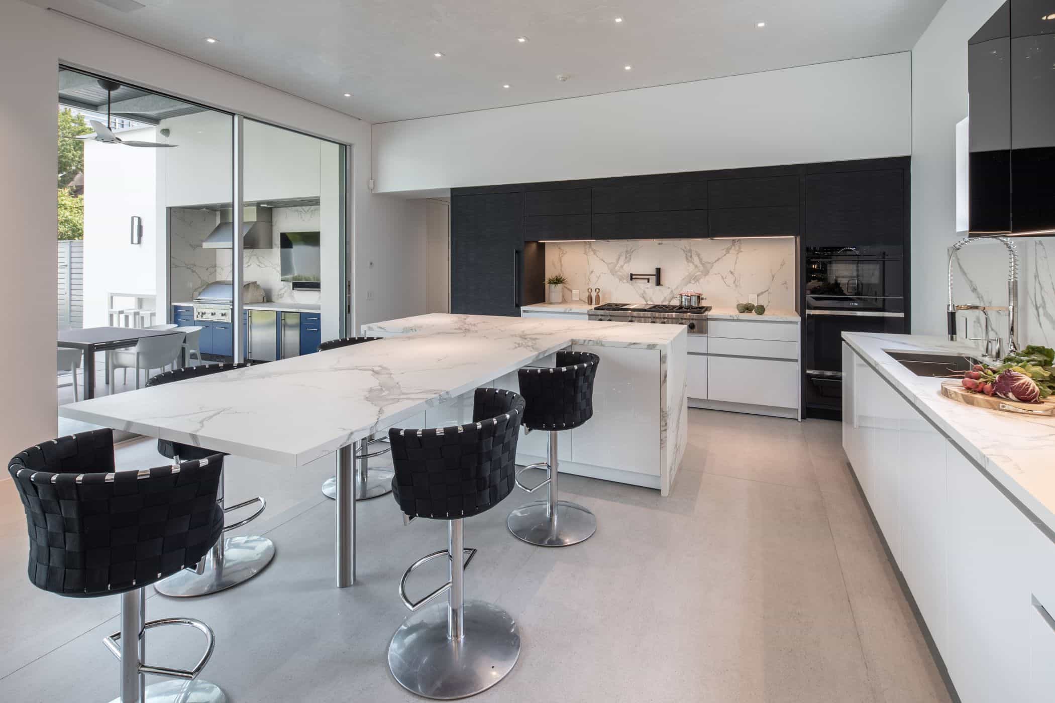 eggersmann houston black and white kitchen with lots of light for an upper kirby new construction home