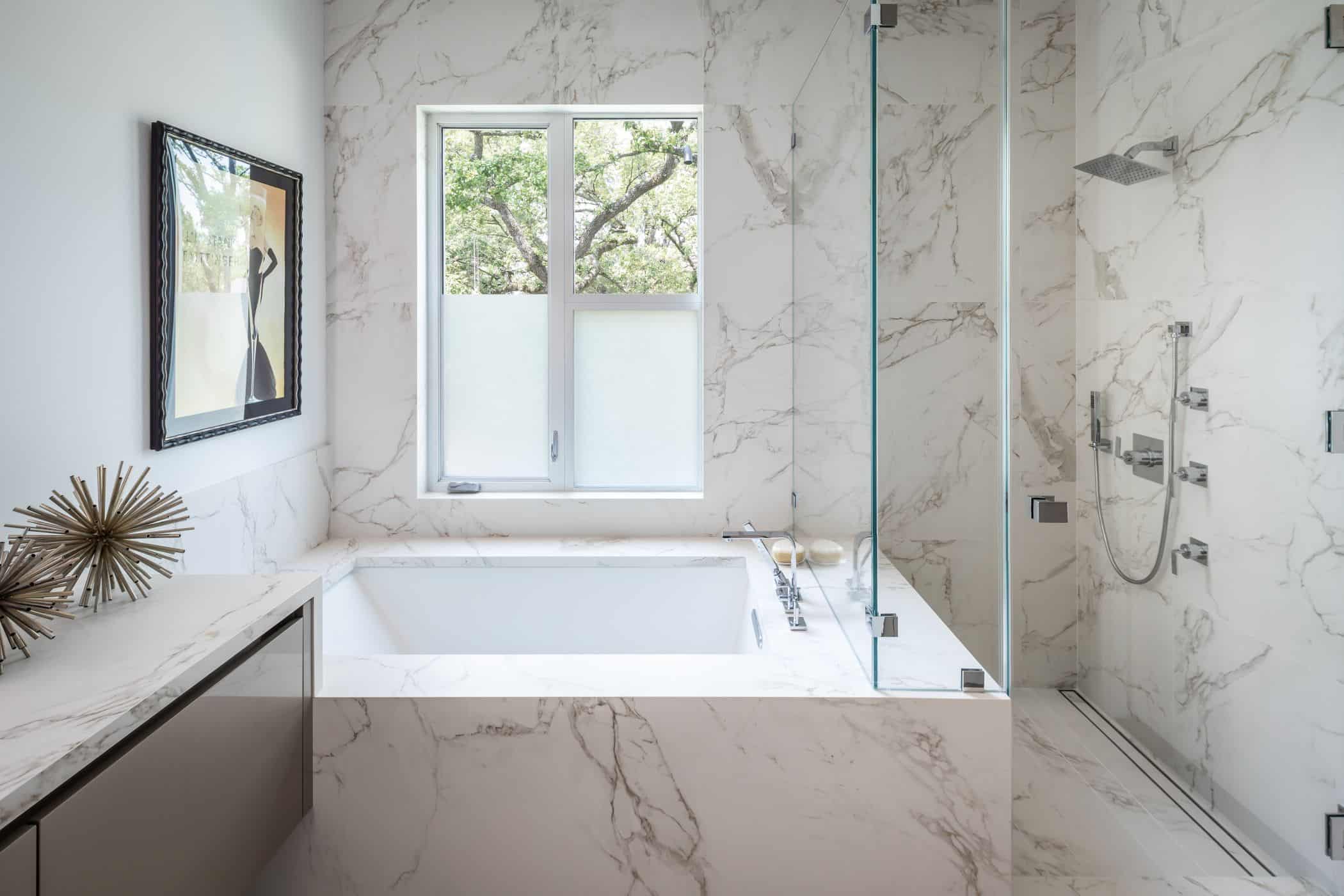 shower tub combo of a master bathroom fitted by eggersmann in a houston new construction home