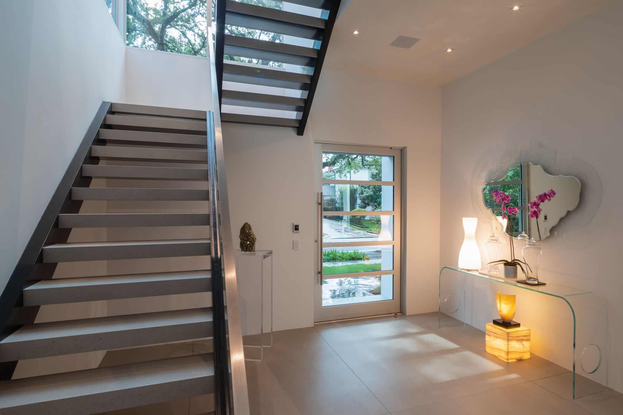 ultra modern open stairwell of master bedroom of a houston new construction home