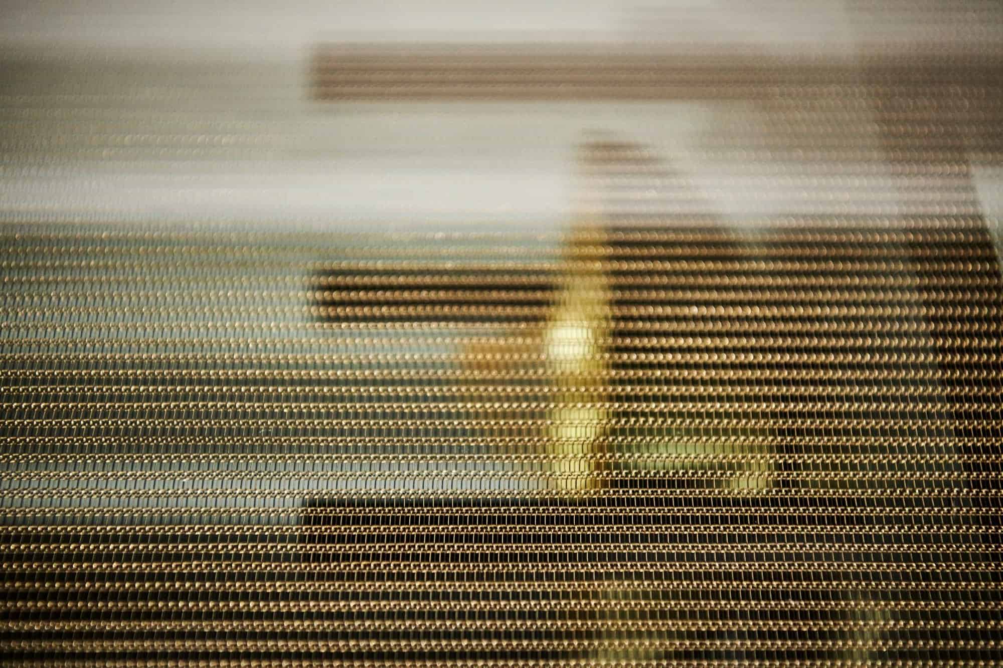 eggersmann's interlink bronze finish is bronzed steel link chains embedded in glass