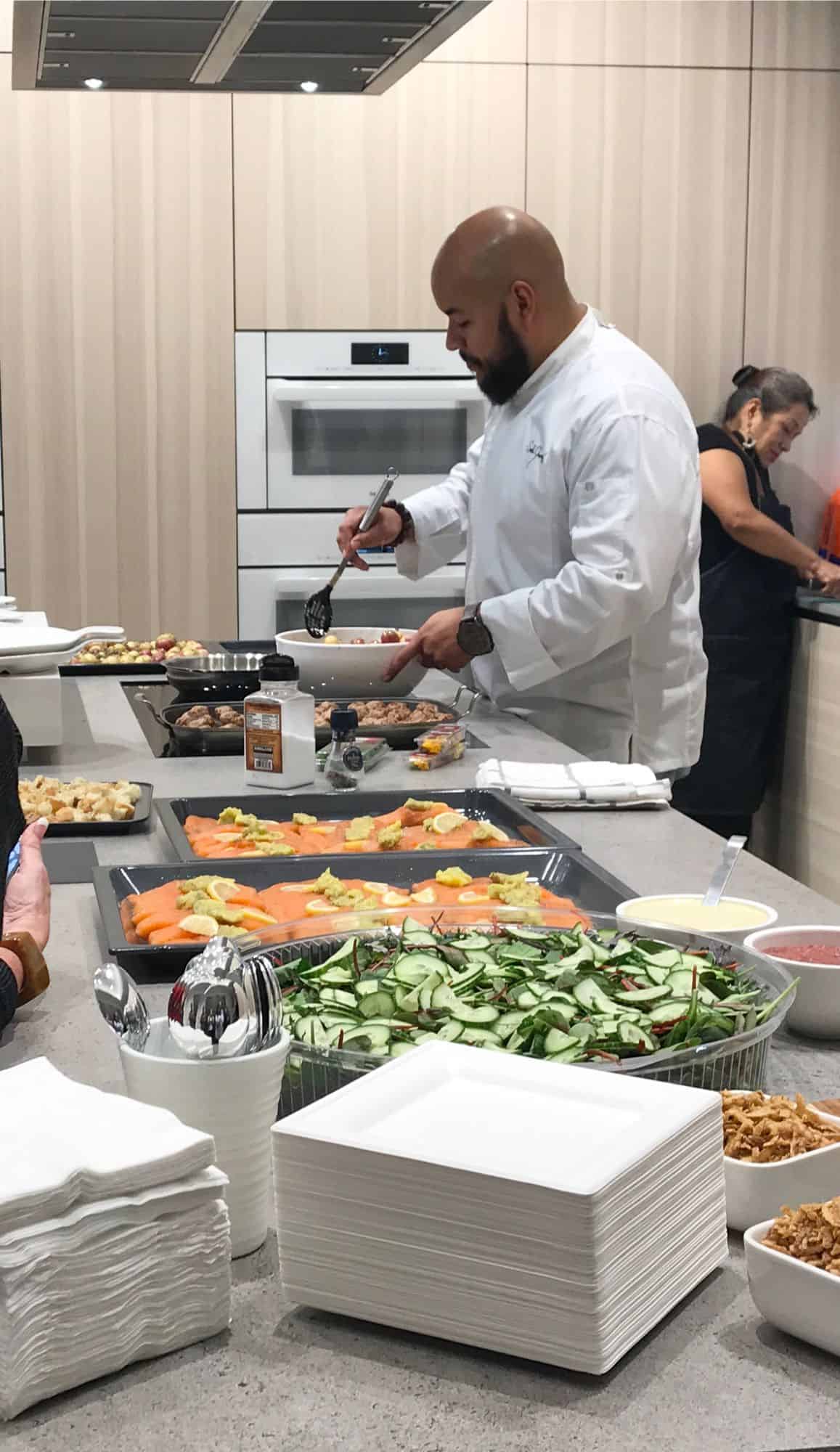 chef saul prepares to serve a gourmet meal cooked on miele appliances to attendees of a january 2020 estate master class held at eggersmann la showrom
