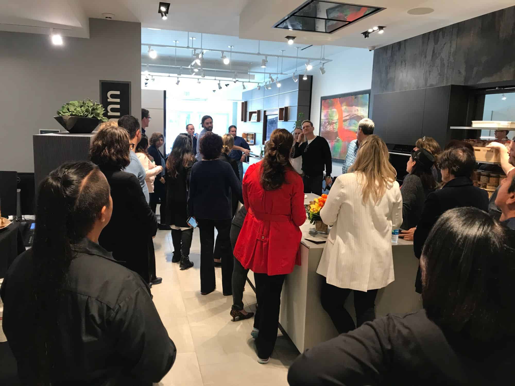 attendees of a january 2020 estate master class touring the eggersmann kitchen and living displays at eggersmann la