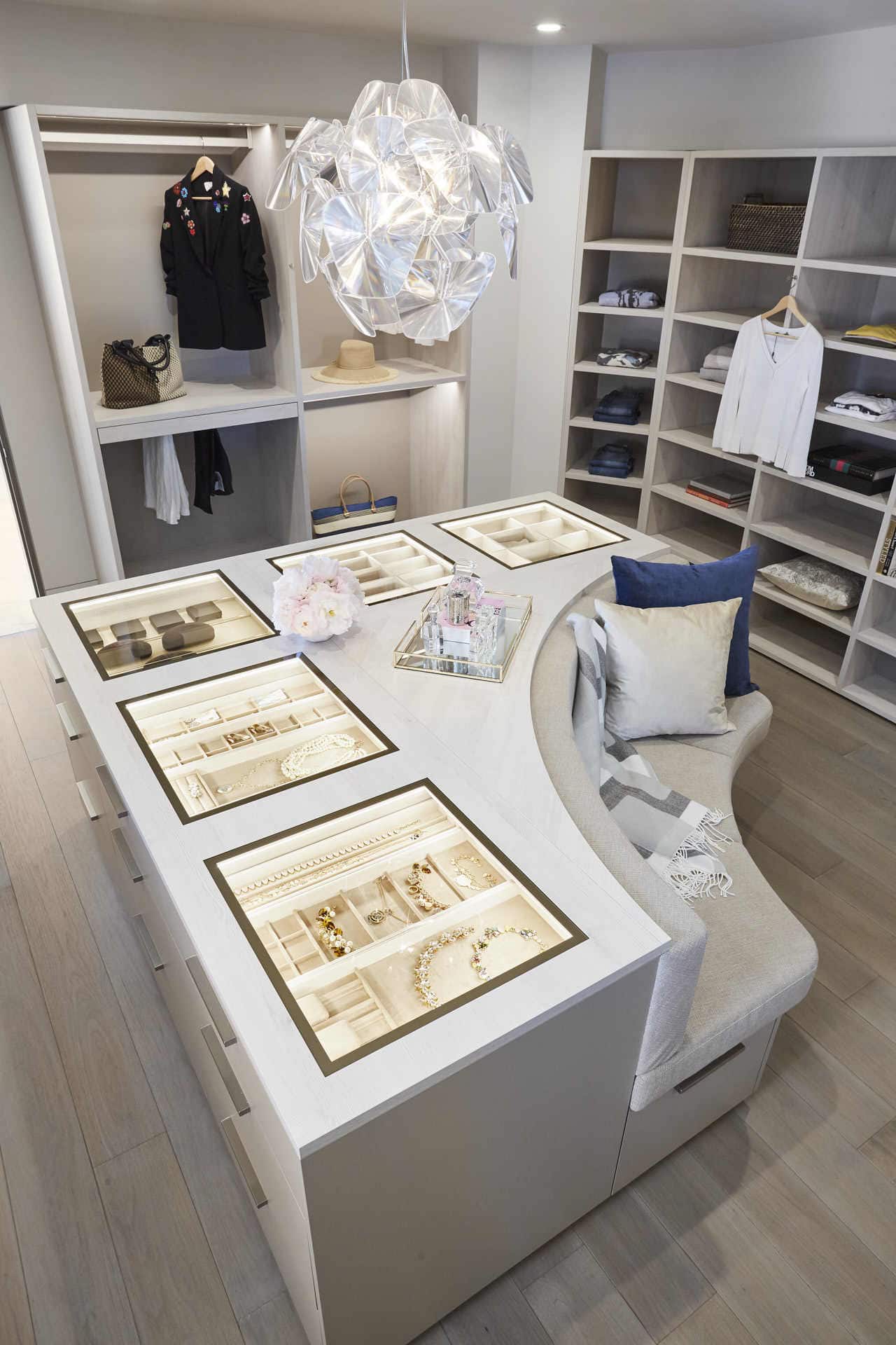 bespoke lined jewelry display case in an island of a bespoke walk-in wardrobe