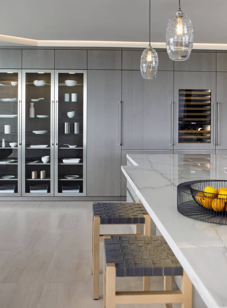 custom wall storage in a corona del mar home's luxury contemporary kitchen