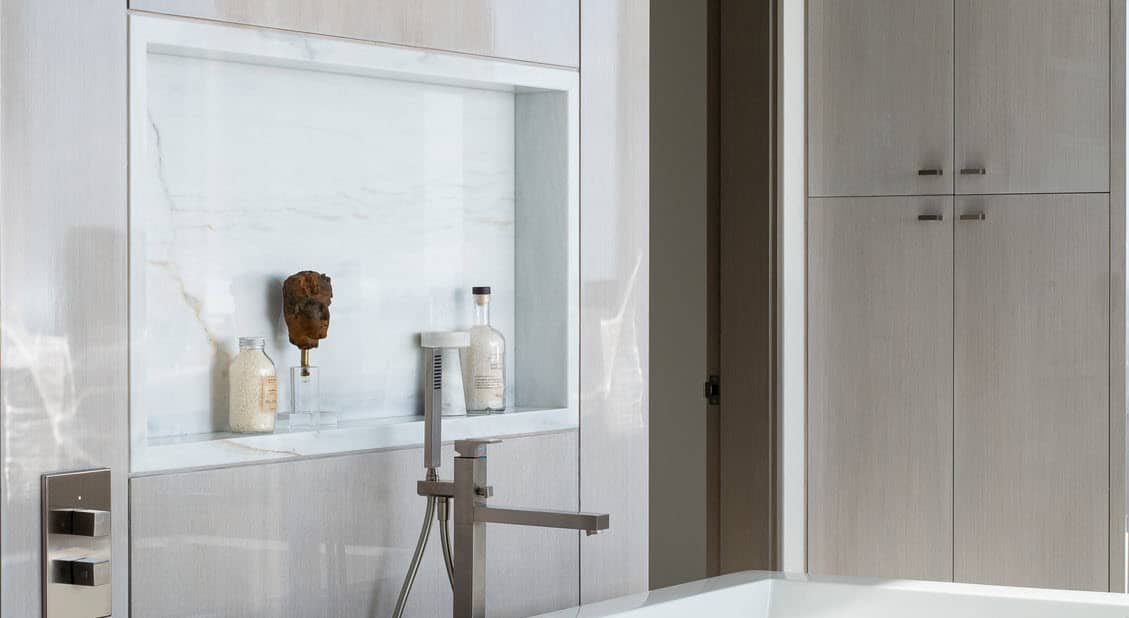 stone niche in 2-tone finish contrasting with a wall in bath storage designed by eggersmann in a multi-million dollar beachfront home in newport news, california