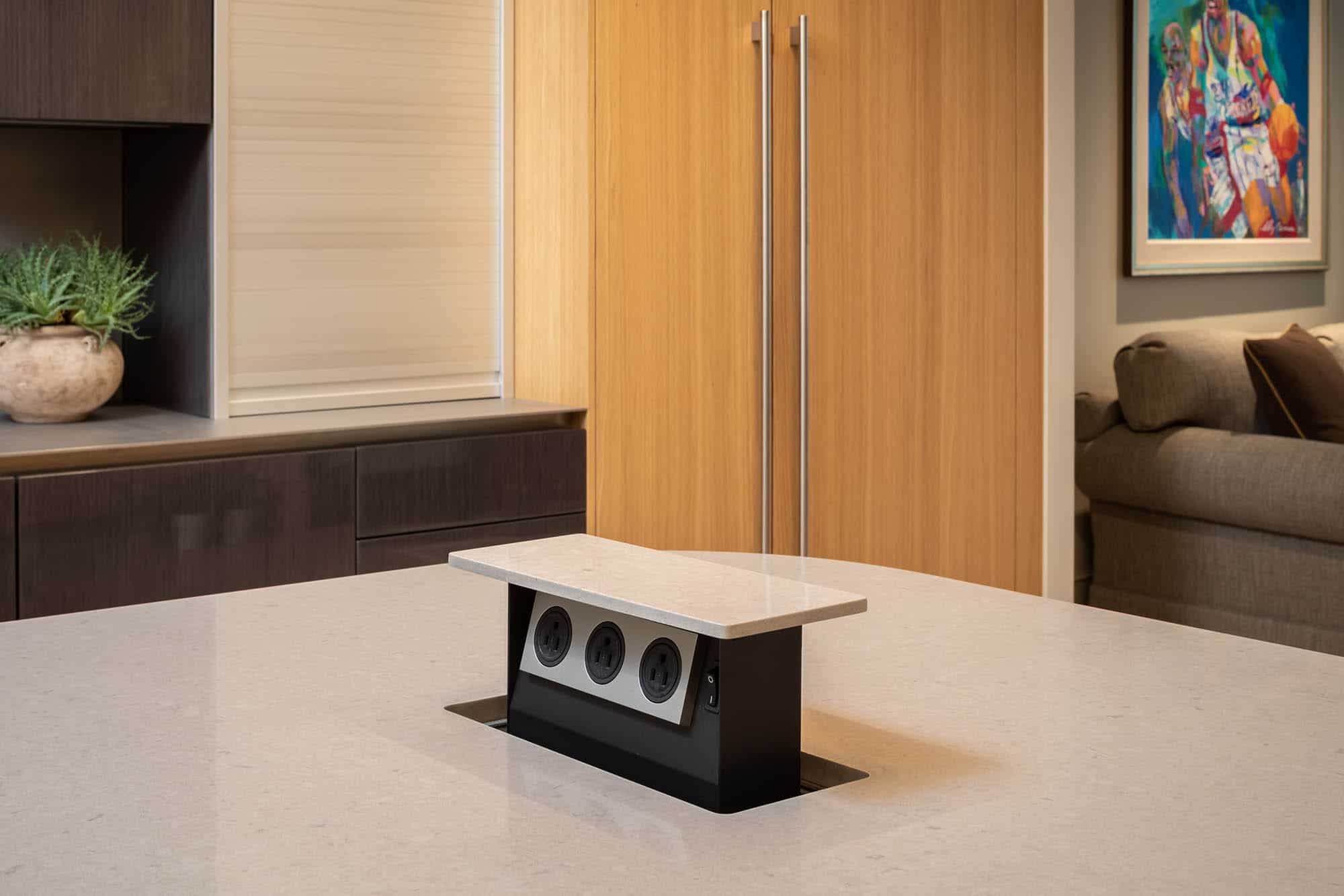 hidden outlets in solid surface countertop are convenient when opened