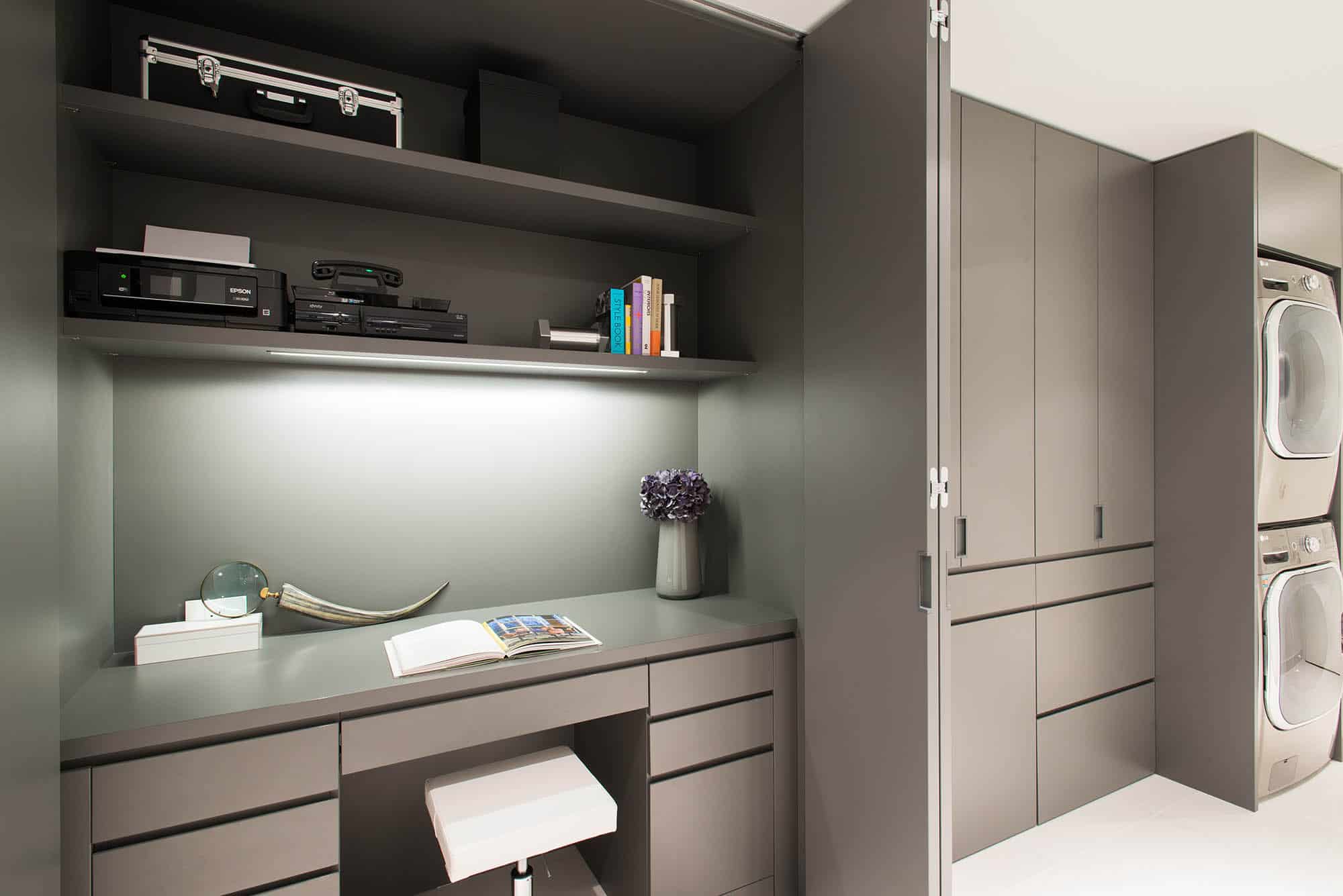 bi-fold doors concel a kitchen desk area