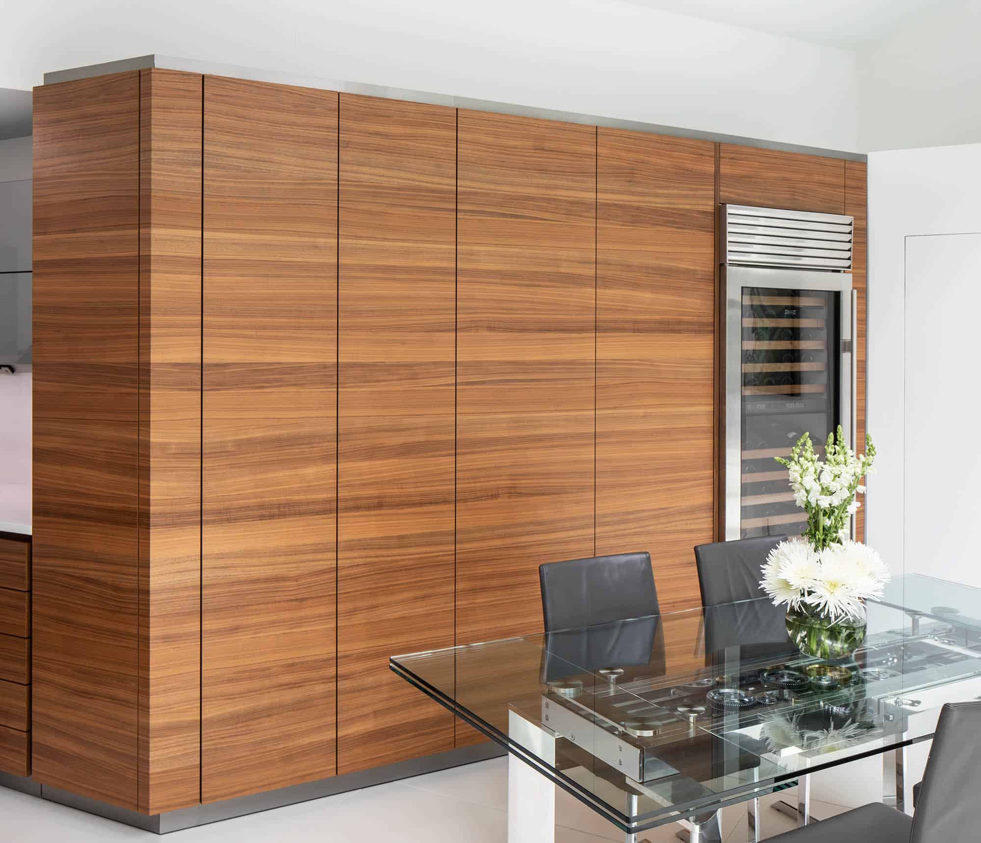 pocket doors conceal a bar and coffee bar with storage