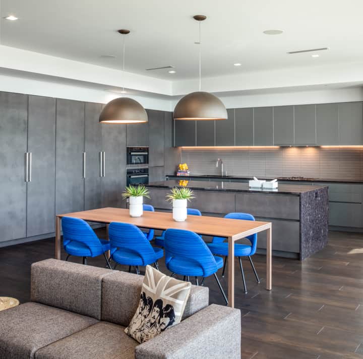 dining room and kitchen in unit 601 kitchen at the mond luxury condos