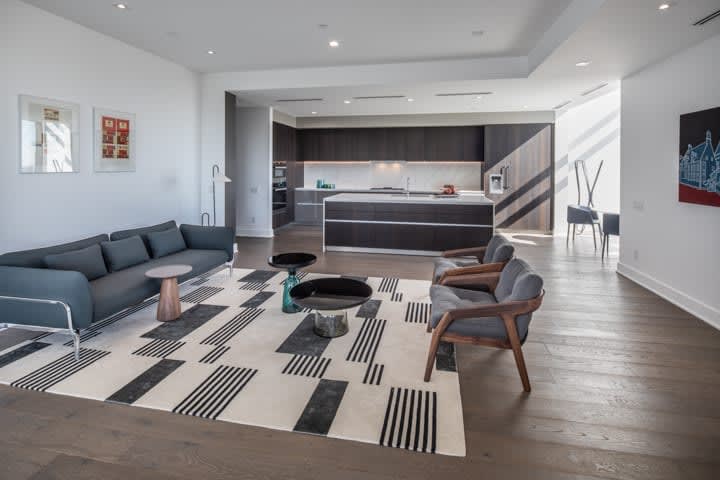 ultra-modern kitchen and living area of in the condo unit 730 of the mond at the museums